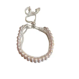 Elegant silver-colored pearl bracelet with rhinestone accents and adjustable slider clasp