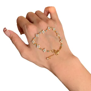 Exquisite 18k gold plated flower bracelet featuring zircon stones and turquoise beads