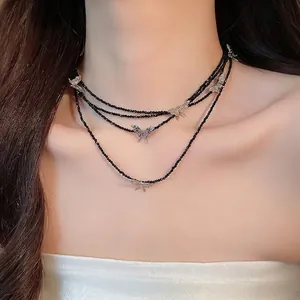 Elegant black beaded layered necklace with silver butterfly charms