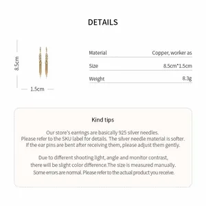 Detail showing 18k gold plated wheat ear tassel earrings with specifications and material info