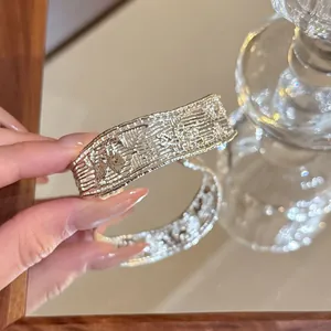 Detailed close-up view of the intricate hollow texture on this silver cuff bracelet