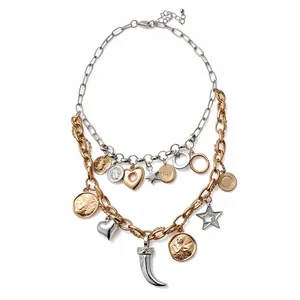 Double-layered mixed metal necklace featuring heart coin and star charms with tusk