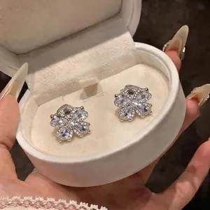 Elegant 18K gold plated flower earrings with sparkling zircons in a white box