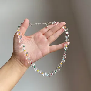 Detailed view of ice-through heart beads on dopamine rainbow beaded necklace