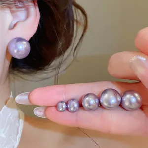 Elegant purple pearl stud earrings 18K gold plated shown in multiple sizes on hand.
