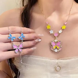 Sweet butterfly rhinestone necklace with colorful flower charms and fringe details.