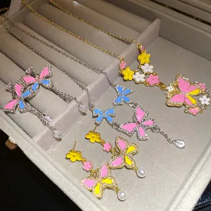 Exquisite detail of colorful butterfly and flower necklace set with shimmering rhinestones