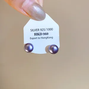 Detail view of round purple pearl stud earrings displayed on a 925 silver product card