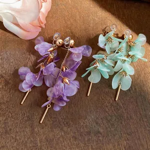 Handmade fairy-like long floral drop earrings featuring purple and mint green petals
