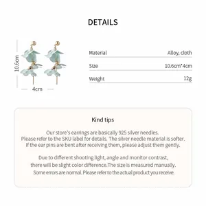 Detailed view of mint blue petal drop earrings with material and size specifications