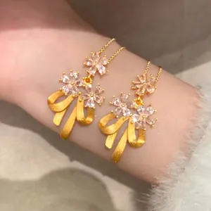 Elegant 24k gold-plated bow necklace with sparkling zircon floral accents for women