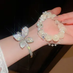 Sparkling zircon butterfly bangle and elegant milky beaded bracelet set for women