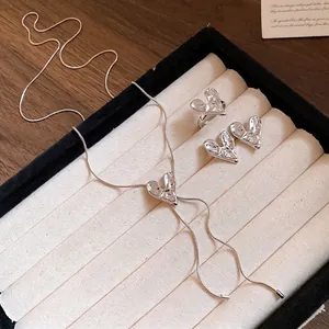 Elegant silver finish crushed heart jewelry set featuring necklace earrings and ring