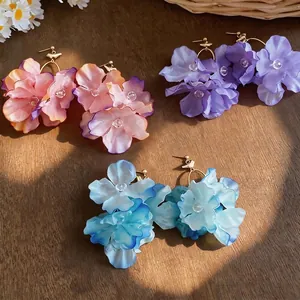 Elegant handmade fabric flower drop earrings in gradient pink purple and blue colors