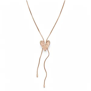 Elegant rose gold heart pendant necklace with intricate engravings on a white background.