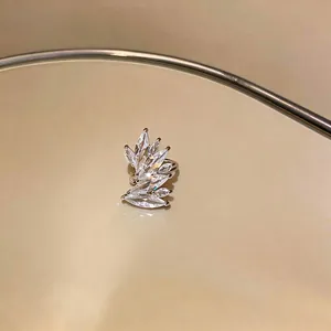 Macro view of an elegant sparkly marquise zircon leaf ear cuff for non-pierced ears