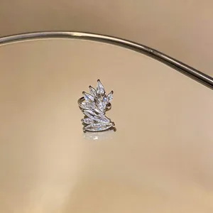 Exquisite macro view of sparkling marquise-cut zircon ear cuff with leaf design