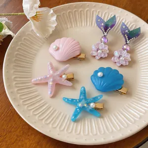 Exquisite ocean themed hair clips with glitter starfish and pearl shell shapes for women
