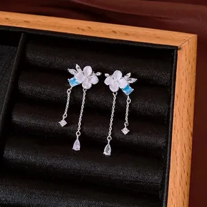 Elegant floral tassel earrings with silver needles and sparkling zircon stones.