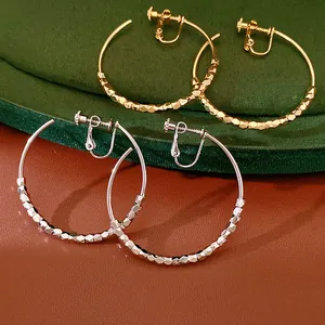 Pair of gold and silver plated faceted bead hoop clip-on earrings for non-pierced ears