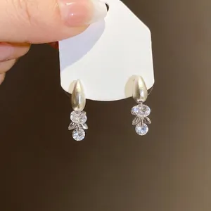 Elegant silver drop earrings featuring clustered clear crystals for a minimalist chic look