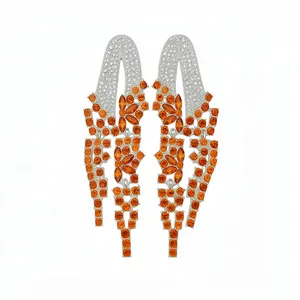 Elegant geometric drop earrings with vibrant orange and white crystals