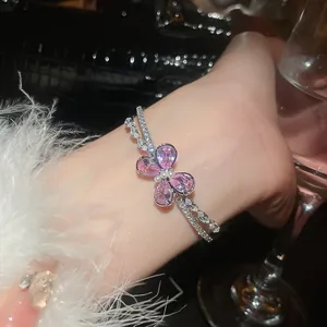 Detailed view of pink zircon butterfly open bracelet with elegant double crystals
