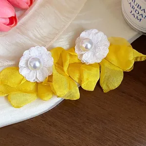 Handmade yellow chiffon flower earrings with white lace petals and pearl centers