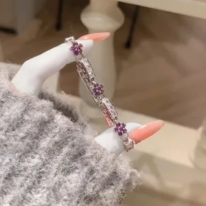Close-up detail of an elegant flower zircon bracelet featuring vivid purple stones