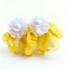 Elegant yellow chiffon flower earrings featuring white pearls and fine lace accents.