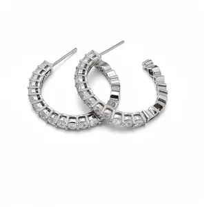 Elegant silver C-shaped hoop earrings featuring sparkling circular cubic zirconia.