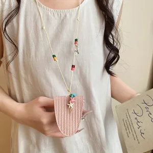 Elegant pink leather glasses holder necklace with colorful starfish charms and beads.