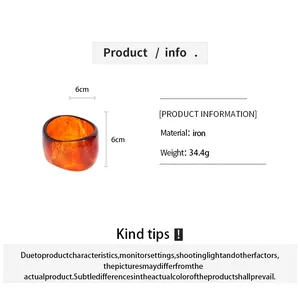 Irregular amber resin bangle details showing 6cm dimensions and 34.4g weight