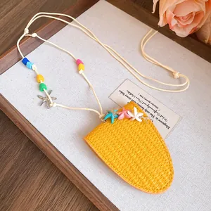 Detail of yellow leather sunglasses holder necklace with colorful starfish and beads.