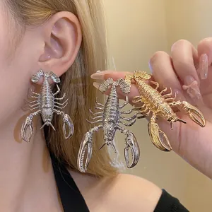 Vintage style metallic lobster statement earrings in gold and silver finish for women