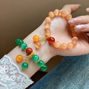Handmade vintage cat's eye stone beaded bracelets in orange and green tones for women