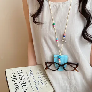 Close-up of leather starfish glasses clip necklace worn as a stylish portable accessory