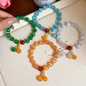 Close-up of elegant cat-eye stone beaded bracelets in multiple colors