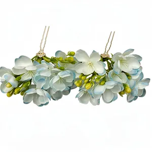 Elegant vintage style fabric flower hairpins in light blue and white with gold metal pins