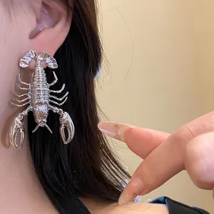 Statement silver metal lobster stud earring shown worn on ear, vintage aesthetic design