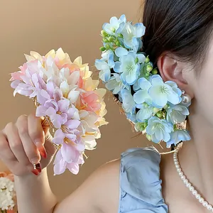 Exquisite handmade fabric floral hairpins in pastel pink and blue colors for elegant styling