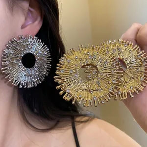 Vintage gold and silver sunburst bee earrings with sparkling rhinestones for elegant styling
