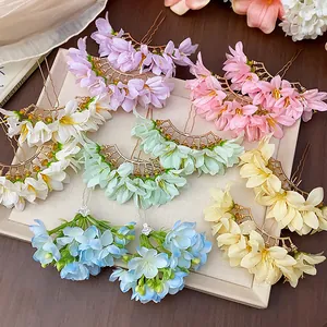 Detailed view of elegant ancient style fabric flower hairpins in multiple pastel colors