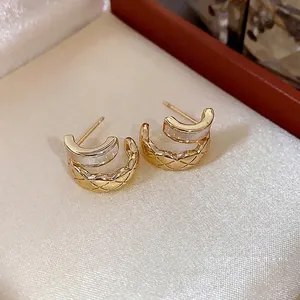 Elegant 18k gold plated C-shaped hoop earrings with quilted lattice pattern and white inlay