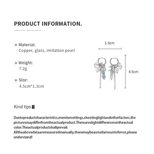 Ficha técnica detallada de pendientes de golondrina con borlas, cristales y perlas
