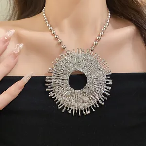Detail macro view of sunburst necklace with rhinestone bee pendant decoration