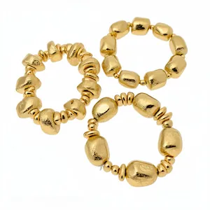 Set of three vintage irregular gold geometric beaded bracelets with a hammered texture
