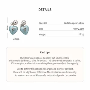 Detailed view of heart-shaped bow earrings with dimensions and material specifications