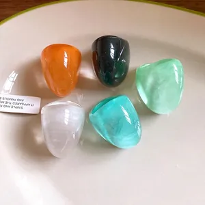 Chunky irregular colorful resin rings set with vibrant marbled and solid finishes for women