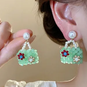 Unique green beaded handbag earrings with pearls in a sweet colorful dopamine style.